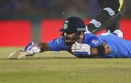 MOHALI, INDIA - MARCH 27:  Virat Kohli of India dives while completing a run during the ICC WT20 India Group 2 match between India and Australia at I.S. Bindra Stadium on March 27, 2016 in Mohali, India.  (Photo by Ryan Pierse/Getty Images)